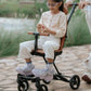 Butt Baby Get Going big kids to small kids travel stroller to scooter in burnt orange, big kids riding